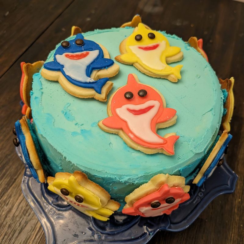 Blue cake with shark cookies